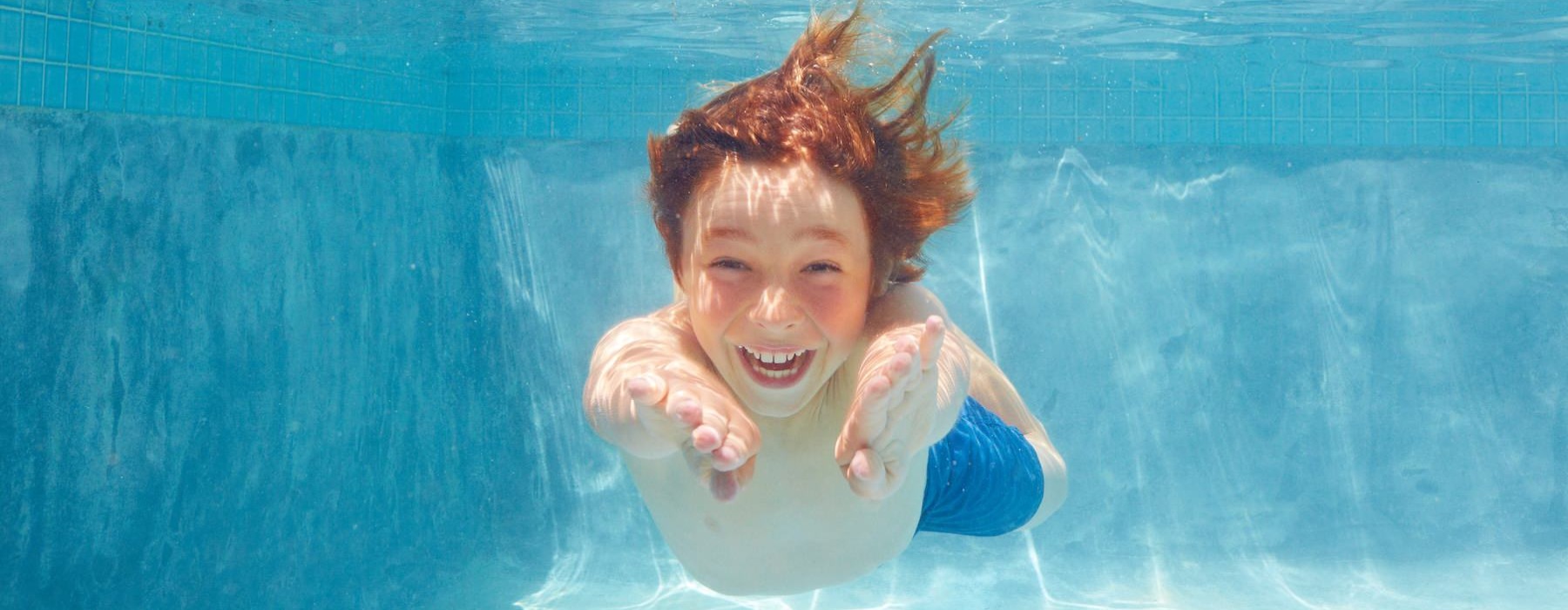 a kid swimming 