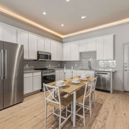 a kitchen with white cabinets