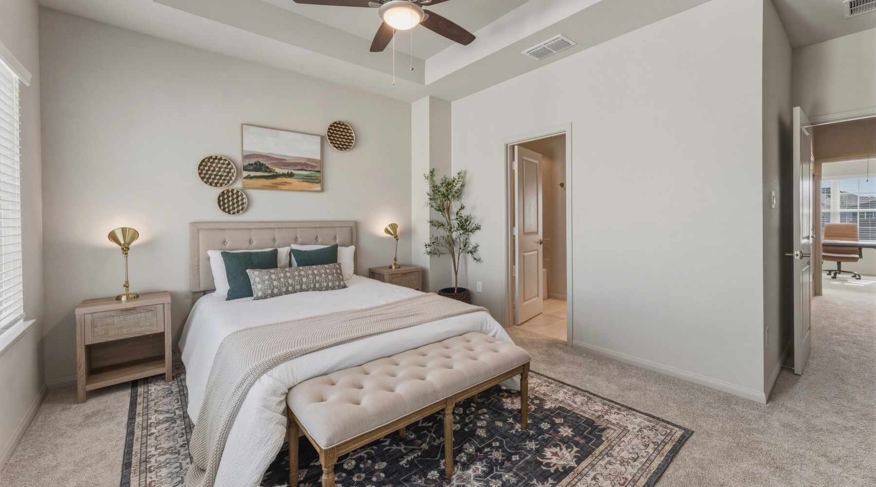 a bedroom with a bed and two nightstands
